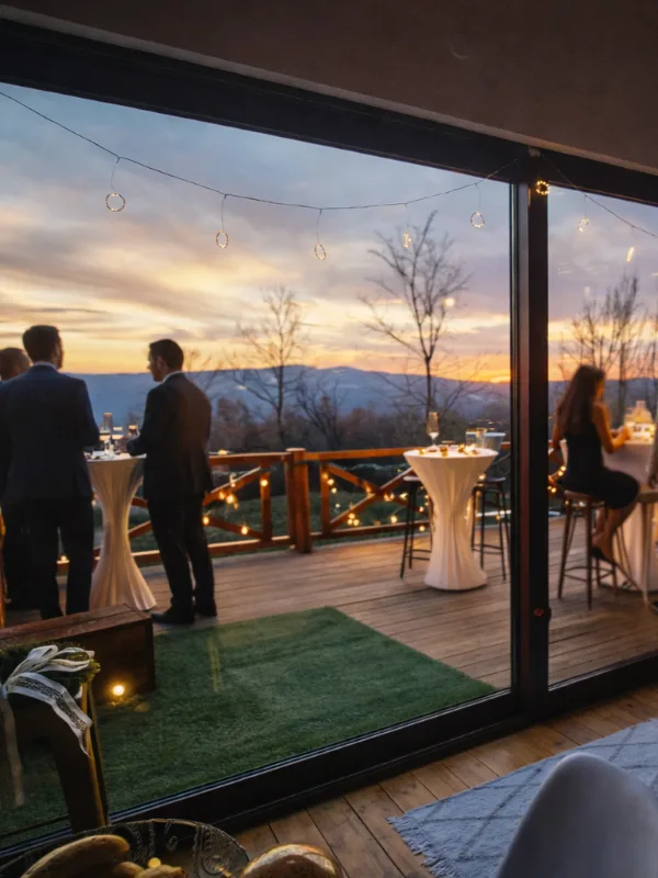 Guests on the terrace during a private event at dusk